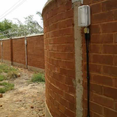 Solar lighting system lights install on school permeter fence thumb